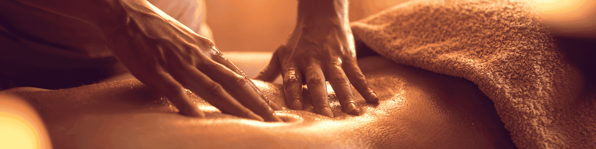 Skilled therapist performing Thai massage on a client in Glasgow clinic.